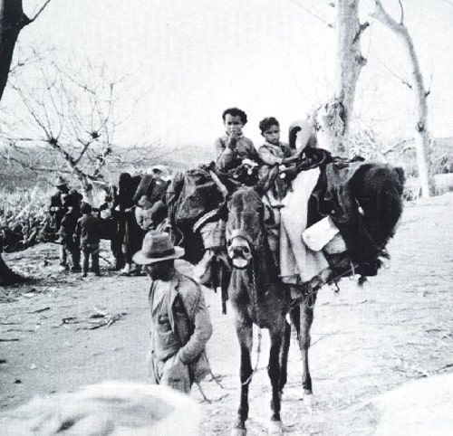 Refugees fleeing the bombing of Malaga.