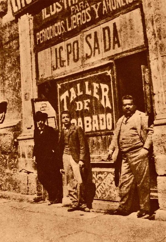 Posada (right) at the door of his studio in Mexico City.