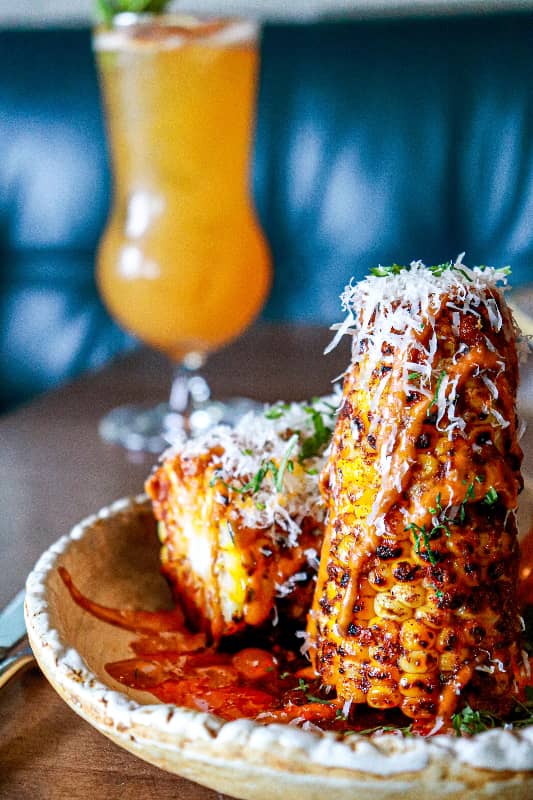 Elotes: Mexican Delicacies with Mayonnaise, Cheese, and Chili.