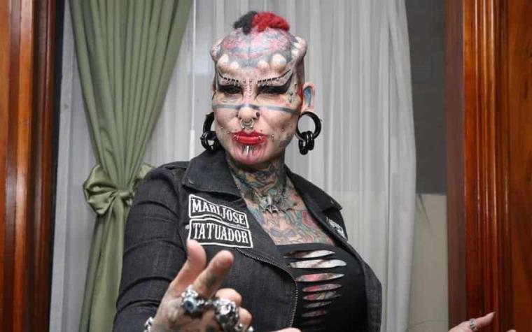 9. Maria Jose Cristerna, also known as "The Vampire Woman", has extensive body modifications including tattoos, piercings, and dental implants. - wide 7