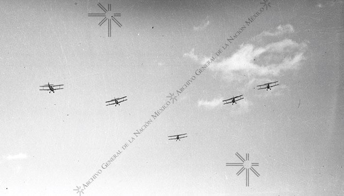 Airplanes flying overhead in aeronautical practice [attributed], ca. 1935-1942.