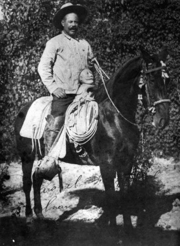Pancho Villa on horseback, portrait.