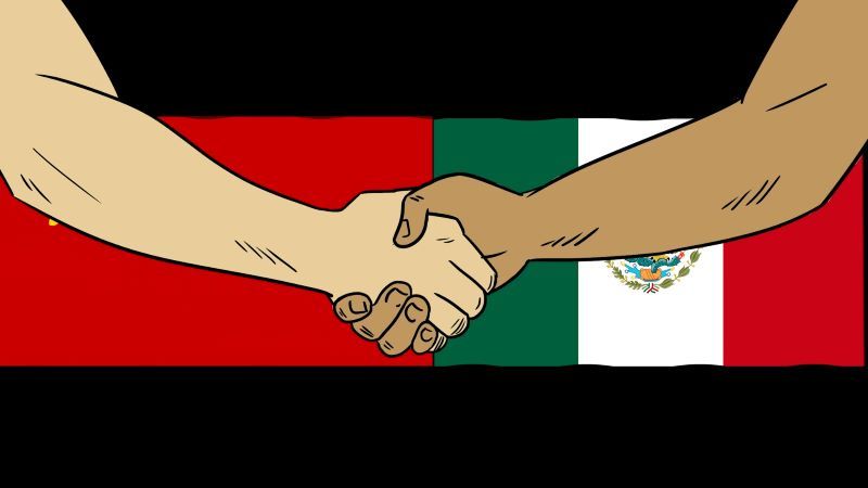 Soviet and Mexican flags with a handshake.