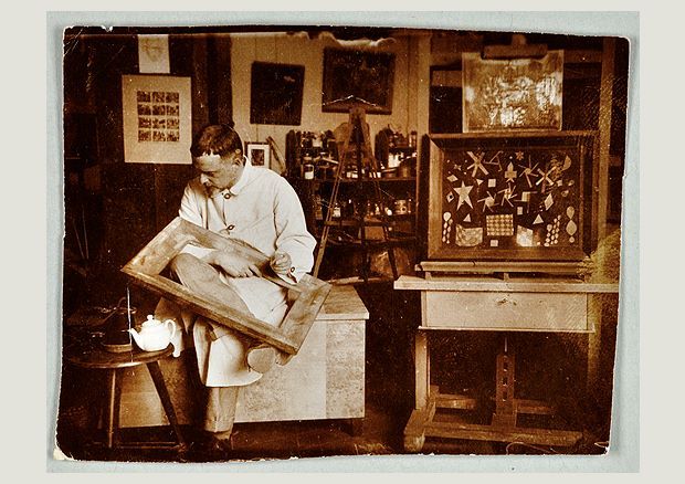 Paul Klee at work in his Bauhaus studio in Weimar, 1924.
