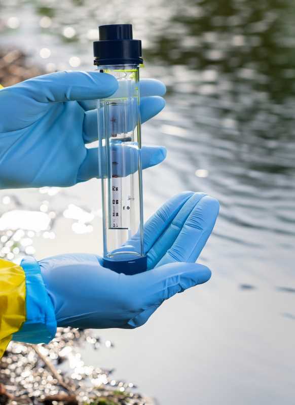 Researchers conduct water quality tests, exemplifying their commitment to integrated water management.