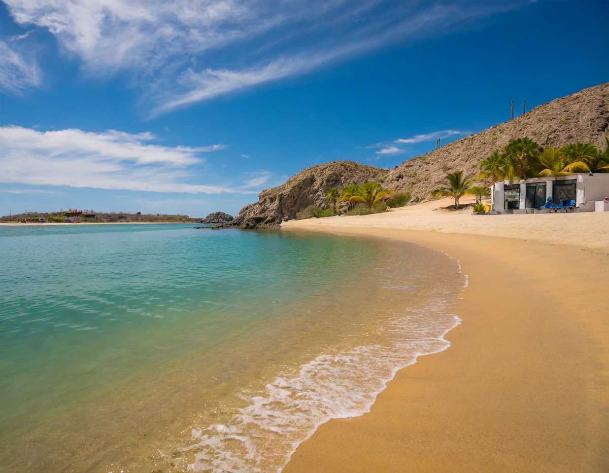 Golden sands and azure waters at Playa El Chileno – Baja California Sur's tropical haven.