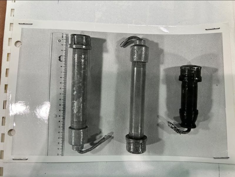 Photograph showing three manufactured explosive devices with nipples and fuses, which Genaro Vázquez Rojas brought with him.