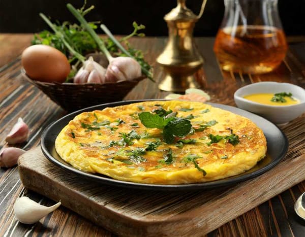 A mouthwatering Smoked Fish Omelet infused with Arab flavors, featuring flaky smoked mullet.