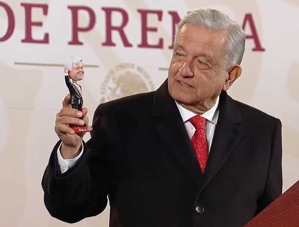 President Andrés Manuel López Obrador holds a 3D-printed figure of himself.