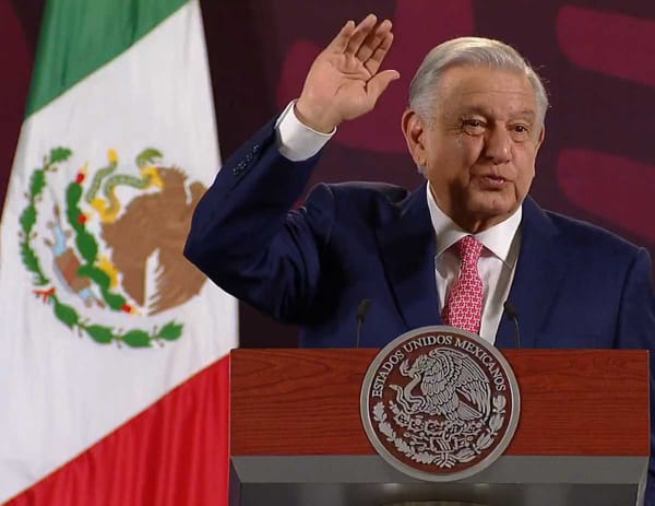 President Andrés Manuel López Obrador stands at a podium addressing a crowd during the Morning Conference.