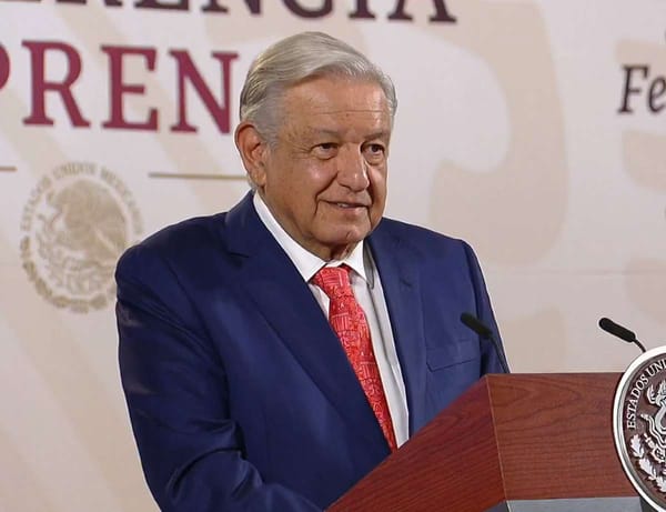 President Andrés Manuel López Obrador speaking at a podium during a press conference.