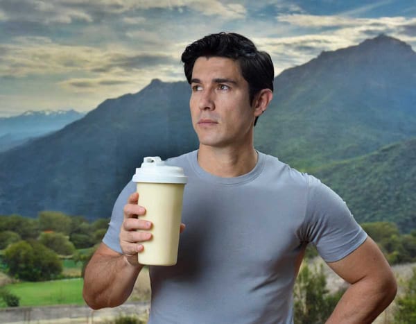 A person with a worried look holds a protein shake, highlighting the potential health concerns.