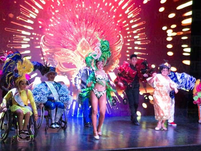 Join in on the fun at Cancun Carnival 2023, where performers dance in colorful costumes.