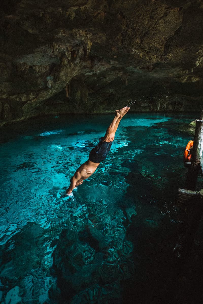 A man is seen jumping in the crystal waters in one of the cenotes in Mexico.