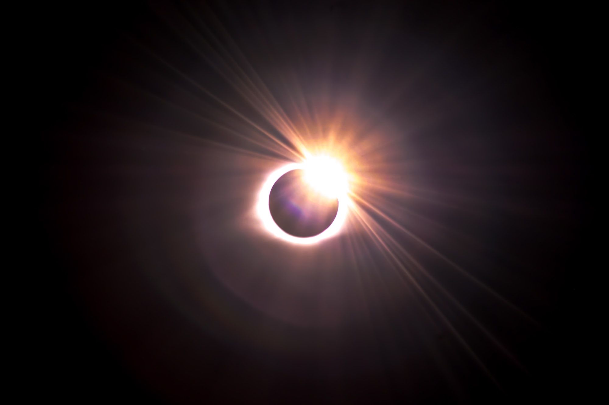 Witness the Earth, Moon, and Sun in a celestial showdown during a total solar eclipse.