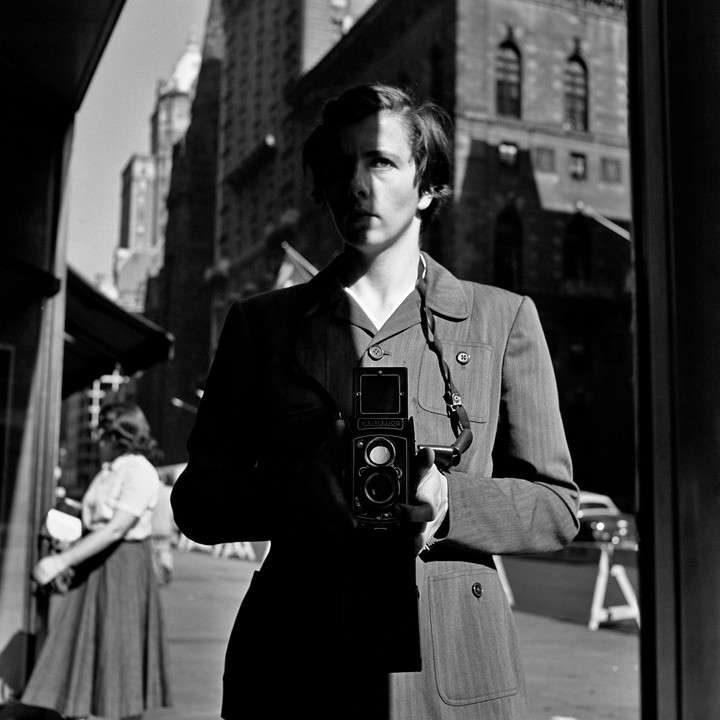 Vivian Maier's self-portrait in New York 1953. Maier with her Rolleiflex around her neck, the camera.