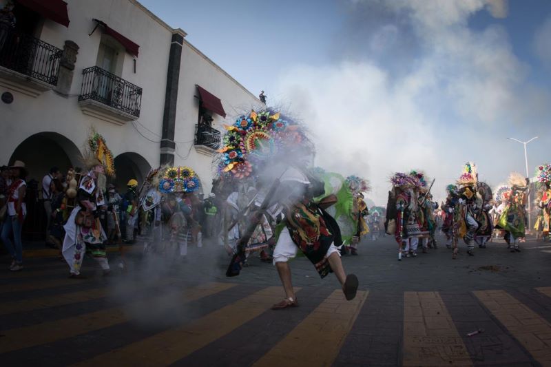 Dancers in colorful costumes celebrate the Carnaval de Huejotzingo.