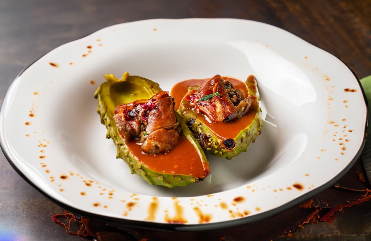 This beautifully plated nopal stuffed with quail in guajillo sauce is a culinary fusion masterpiece.