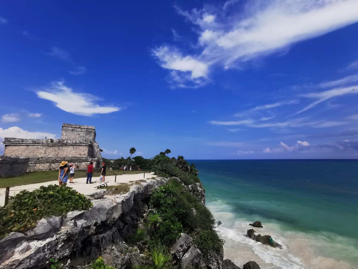 Explore the stunning ruins of Tulum and witness the breathtaking views of ancient stone walls.
