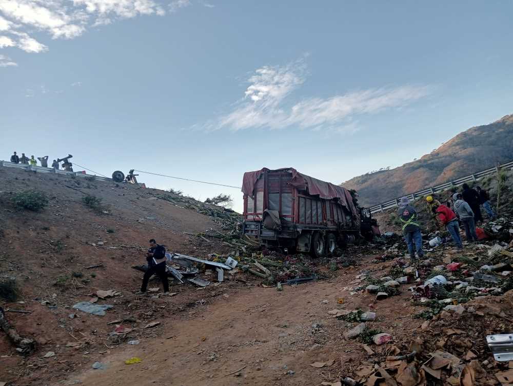 The overturned tractor-trailer on the Jala-Compostela toll highway in Nayarit, Mexico.
