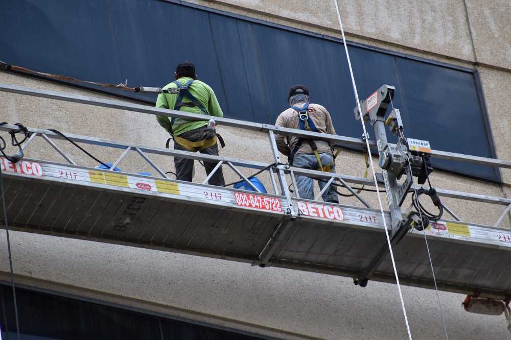 Workers equipped with safety gear, representing the increased focus on preventive measures.