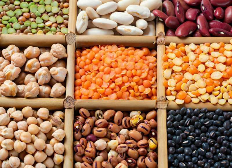A vibrant medley of legumes: lentils, chickpeas, and beans, showcasing the rich diversity of superfoods.