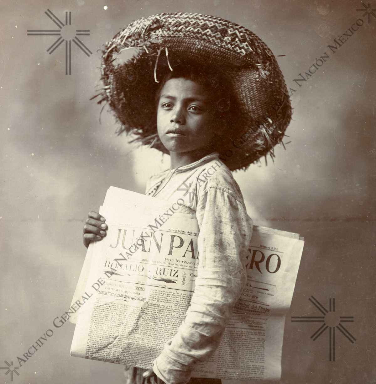 Boy voceador with a copy of the newspaper “Juan Panadero” published in Guadalajara, Jalisco (1905).
