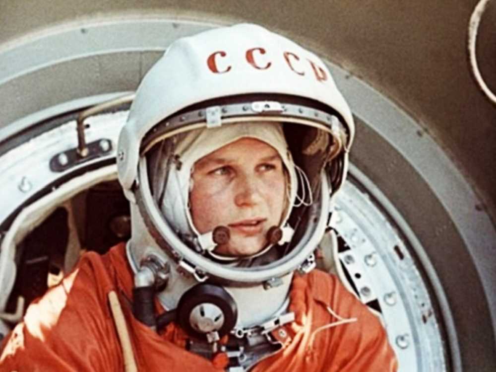 Valentina Tereshkova poses beside the Vostok 6 rocket, moments before making history as the first woman to orbit Earth.