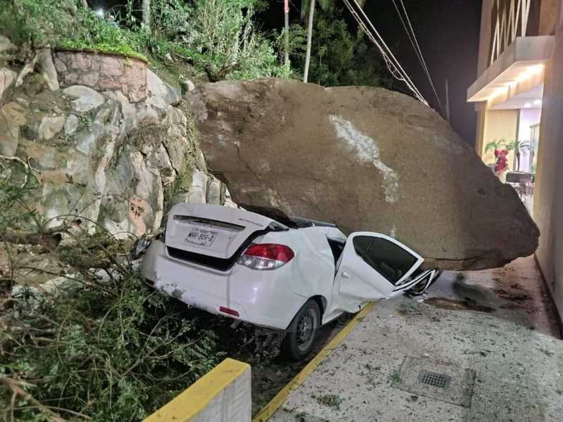 One of the rocks fell on a vehicle, however, no persons were found inside.